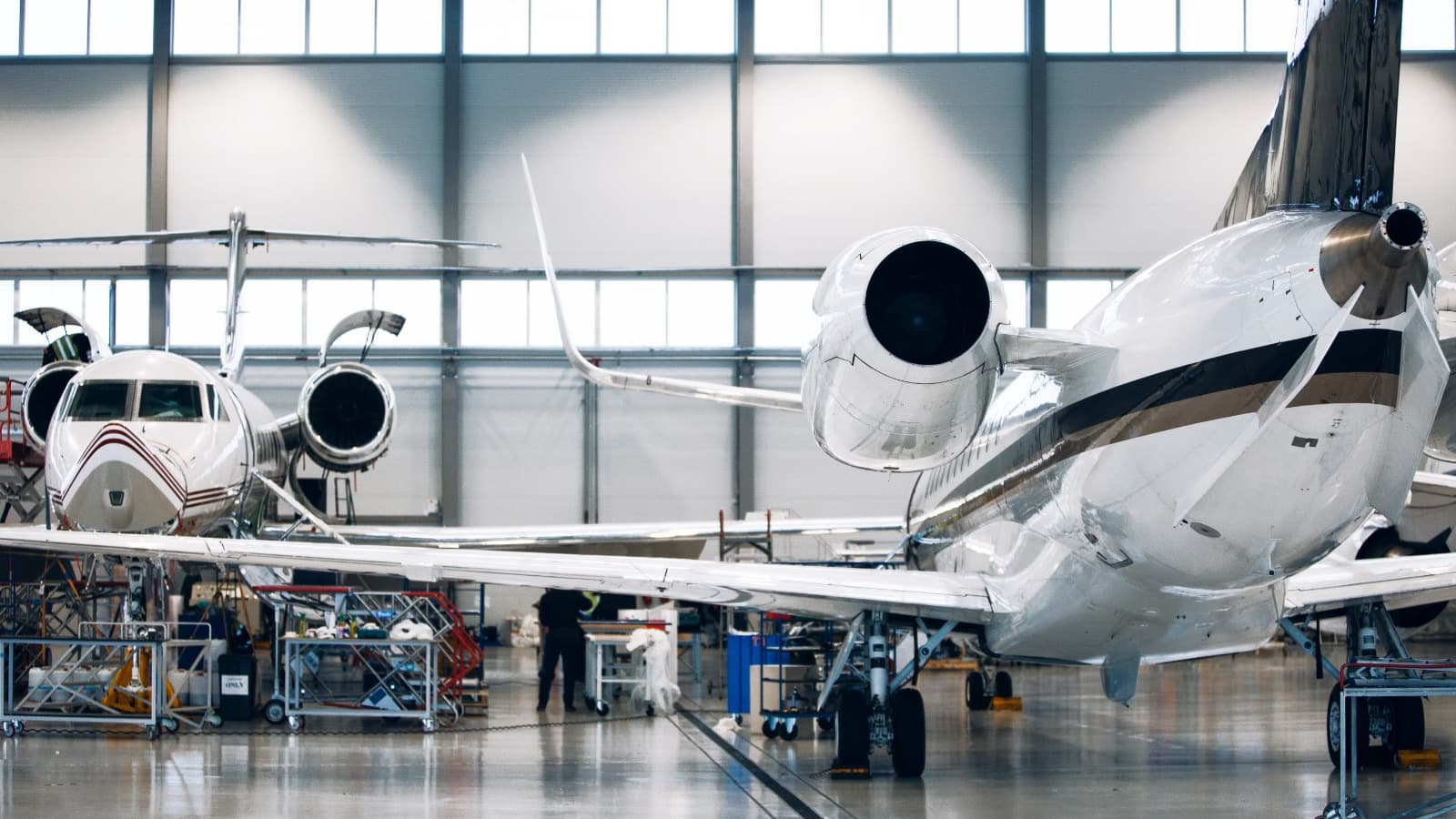 Hangar image with some airplanes under maintenance